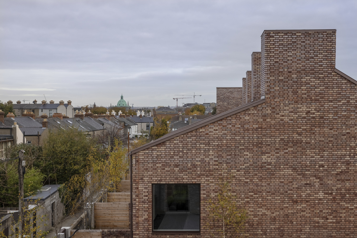 The gable end of a terrace. The done of Rathmines chruch can be seen in the distance, contextulising the sites location