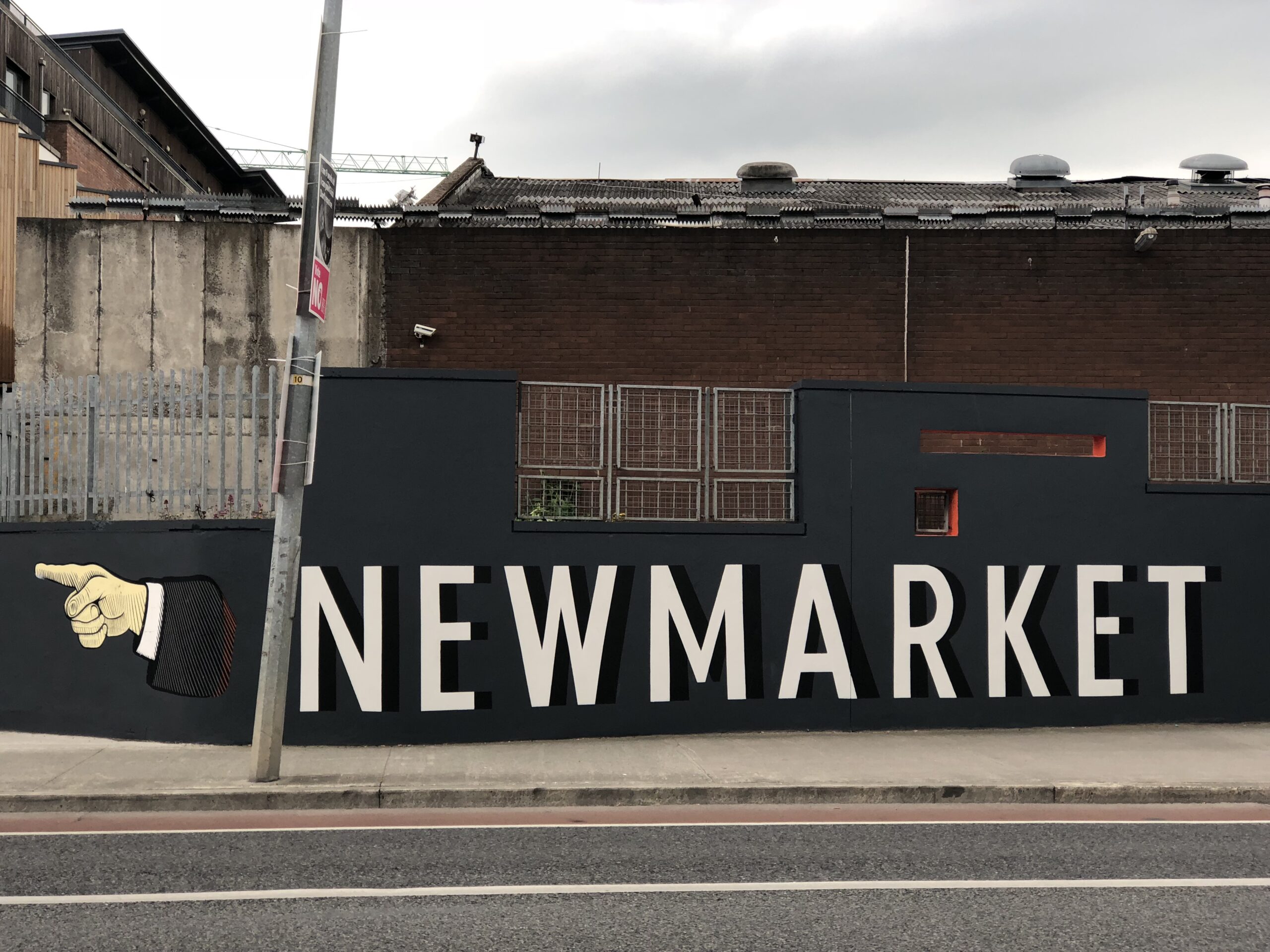 Street view of black wall where it reads: Newmarket