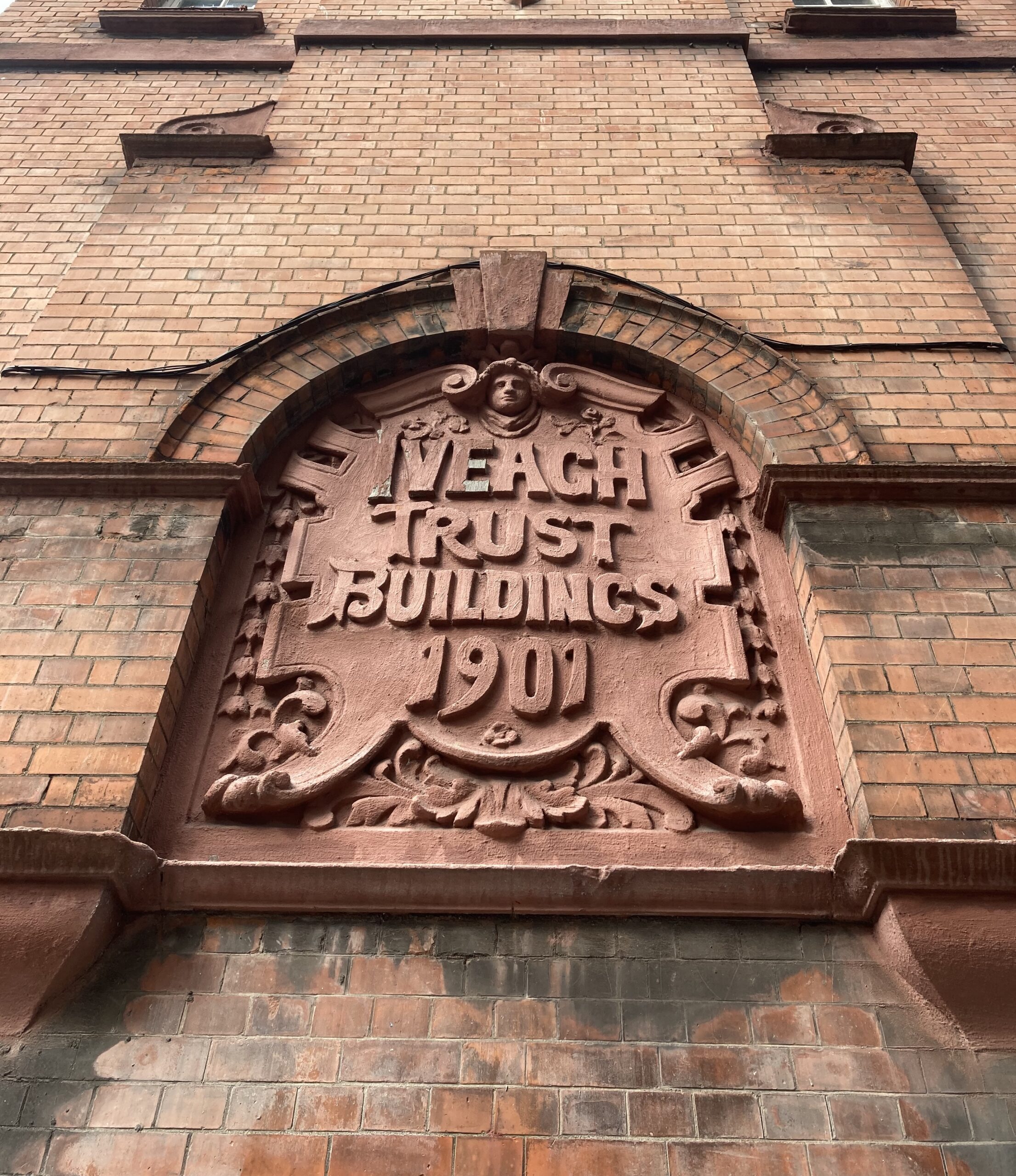 Plaque on Bull Alley façade of Iveagh Buildings where it reads Iveagh Trust Buildings 1907