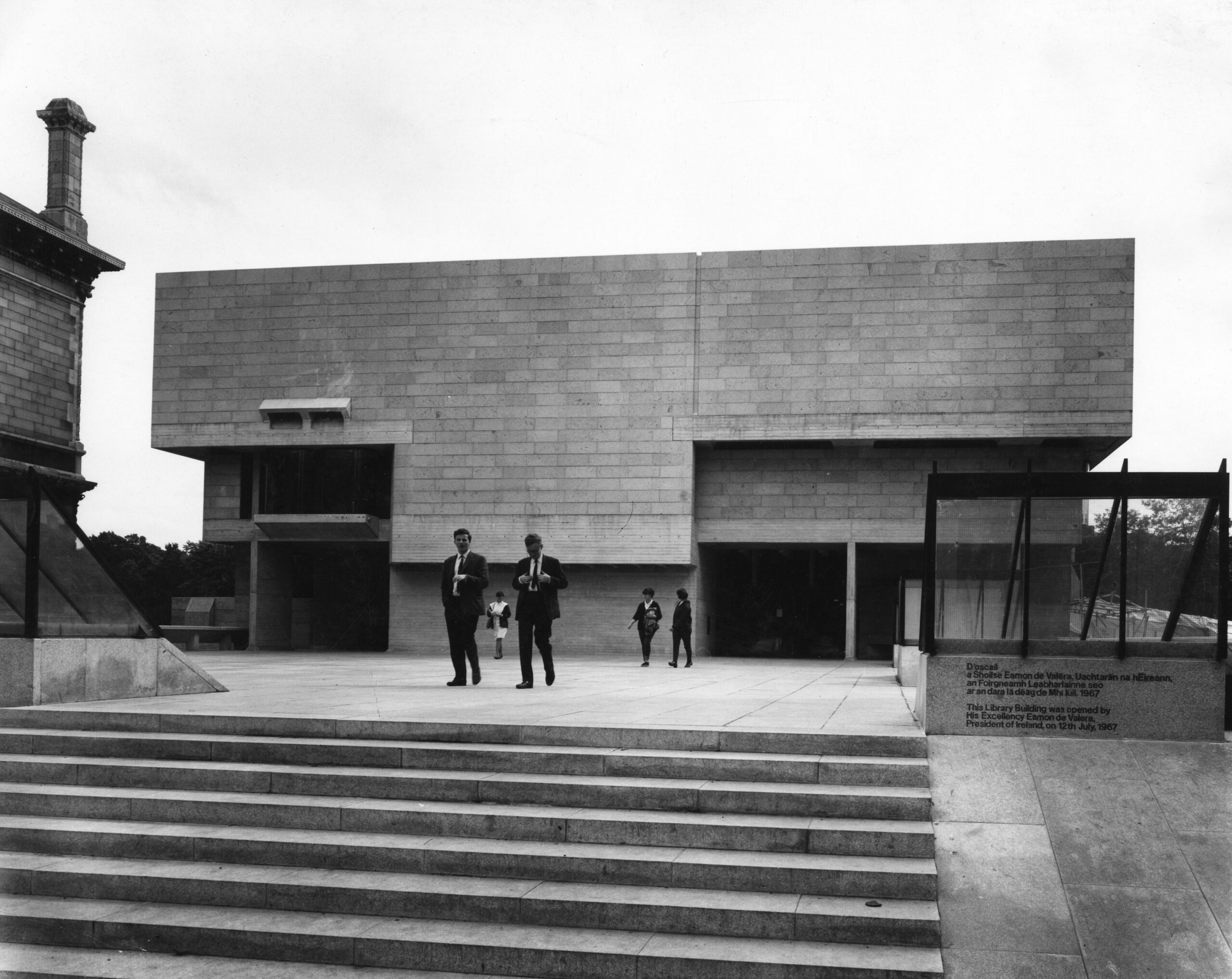Exterior of brutalist building with stairway on the foreground Berkeley Library Facade