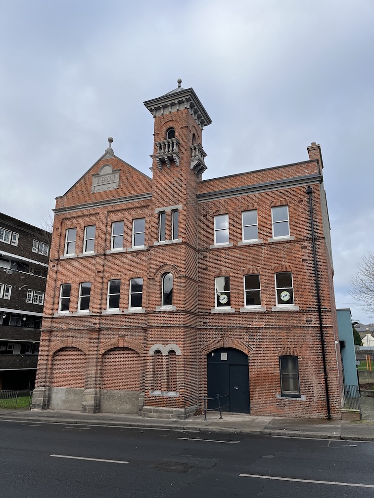 The front facade of Dorset Street Fire Station, a three storey red brick building,  following completion of the conservation and repair works