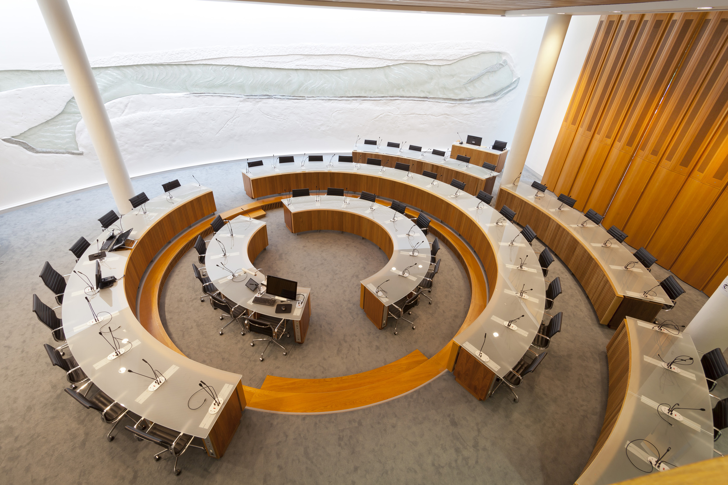 High level view of Council Chamber with long circular tables