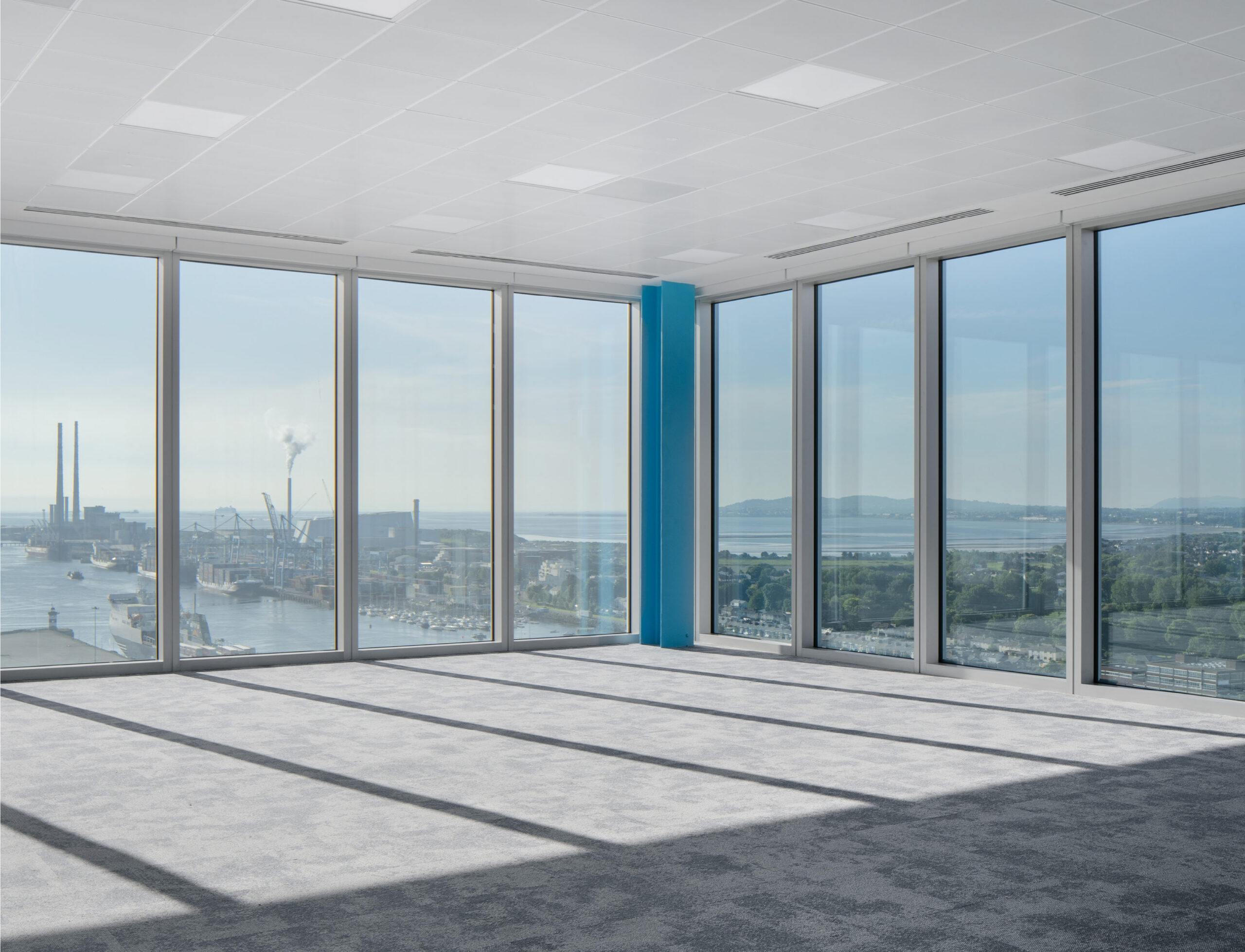 View from inside the Level 17 of building with tall windows overlooking East towards Dublin Bay