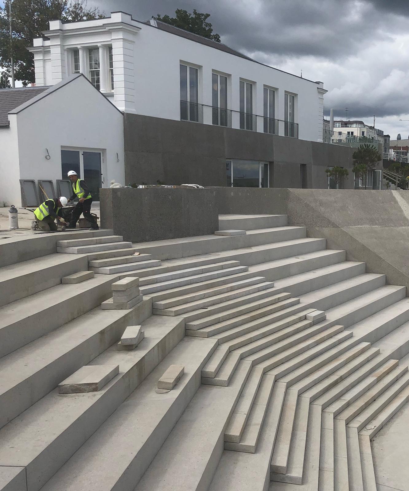 View of the sea-facing side of Dún Laoghaire Baths Pavilion building and steps during construction phase.