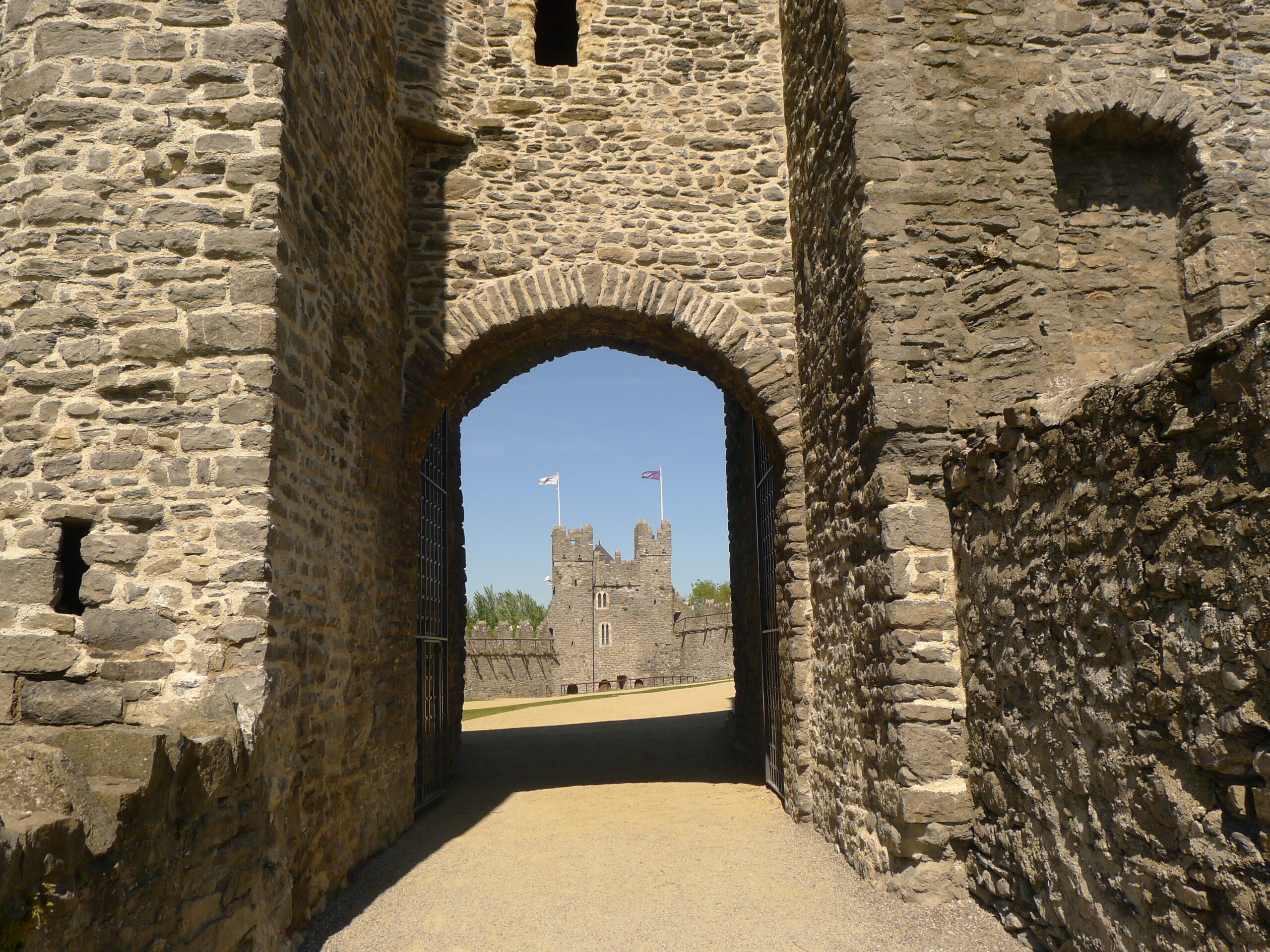 Entrance gate of medieval castle with Constables Tower in background