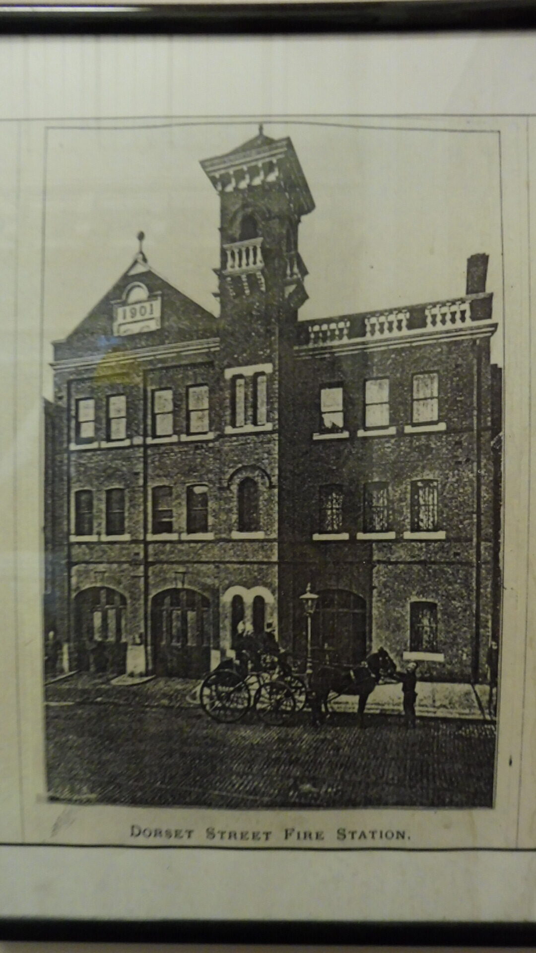 Historic photo of the fire station, a three storey red brick building